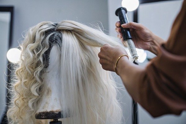 Wig color application Professional stylist applying wig color on mannequin (ID#3)